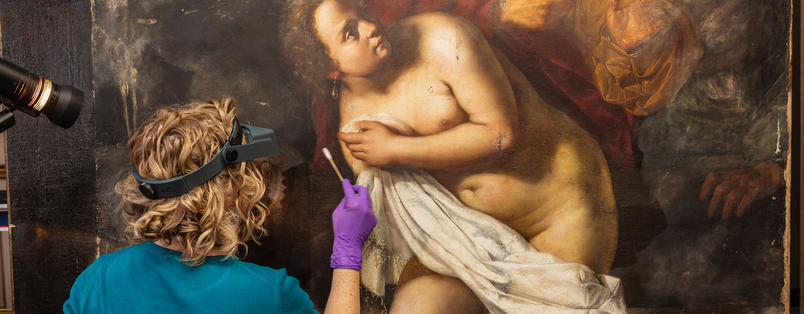 A conservator works on <i>Susanna and the Elders</i> (RCIN 402702) A conservator works on Susanna and the Elders