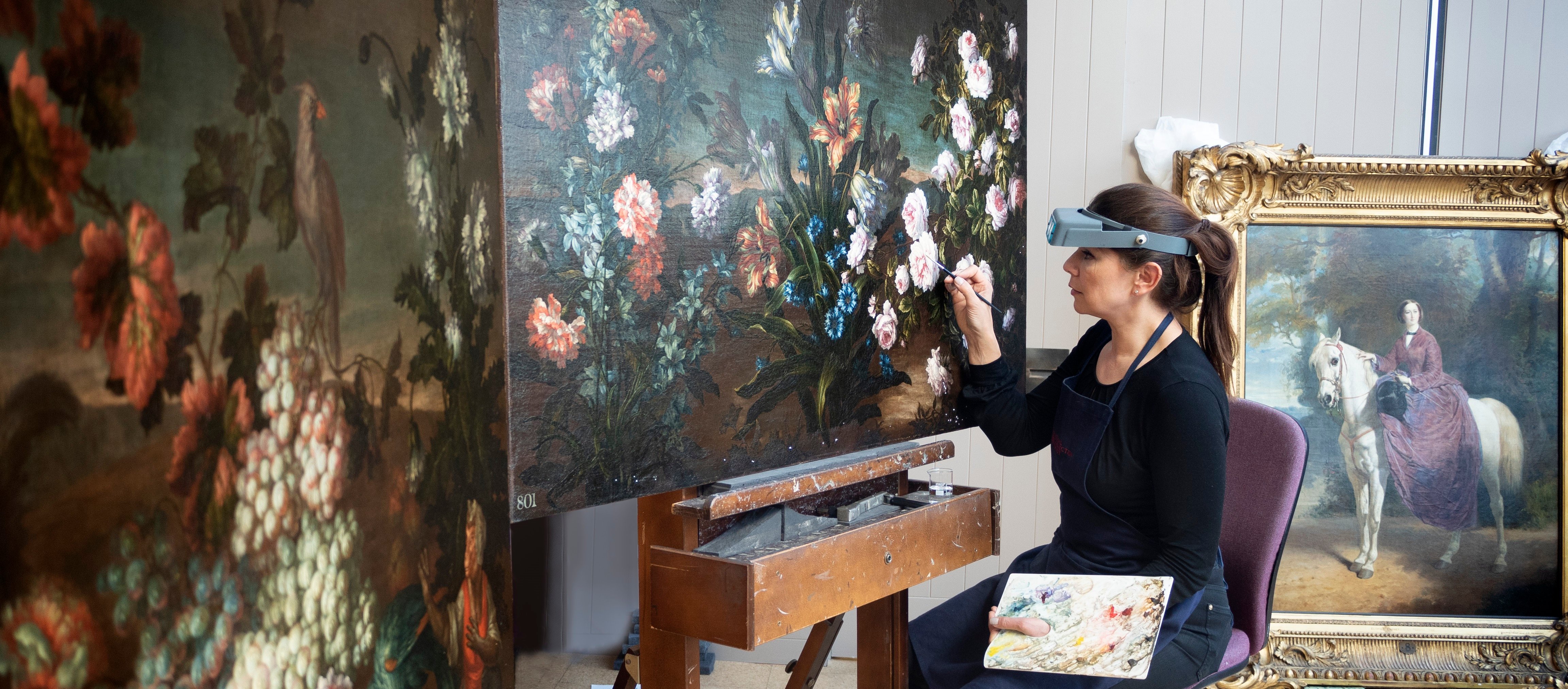 Staff work in picture conservation studio
