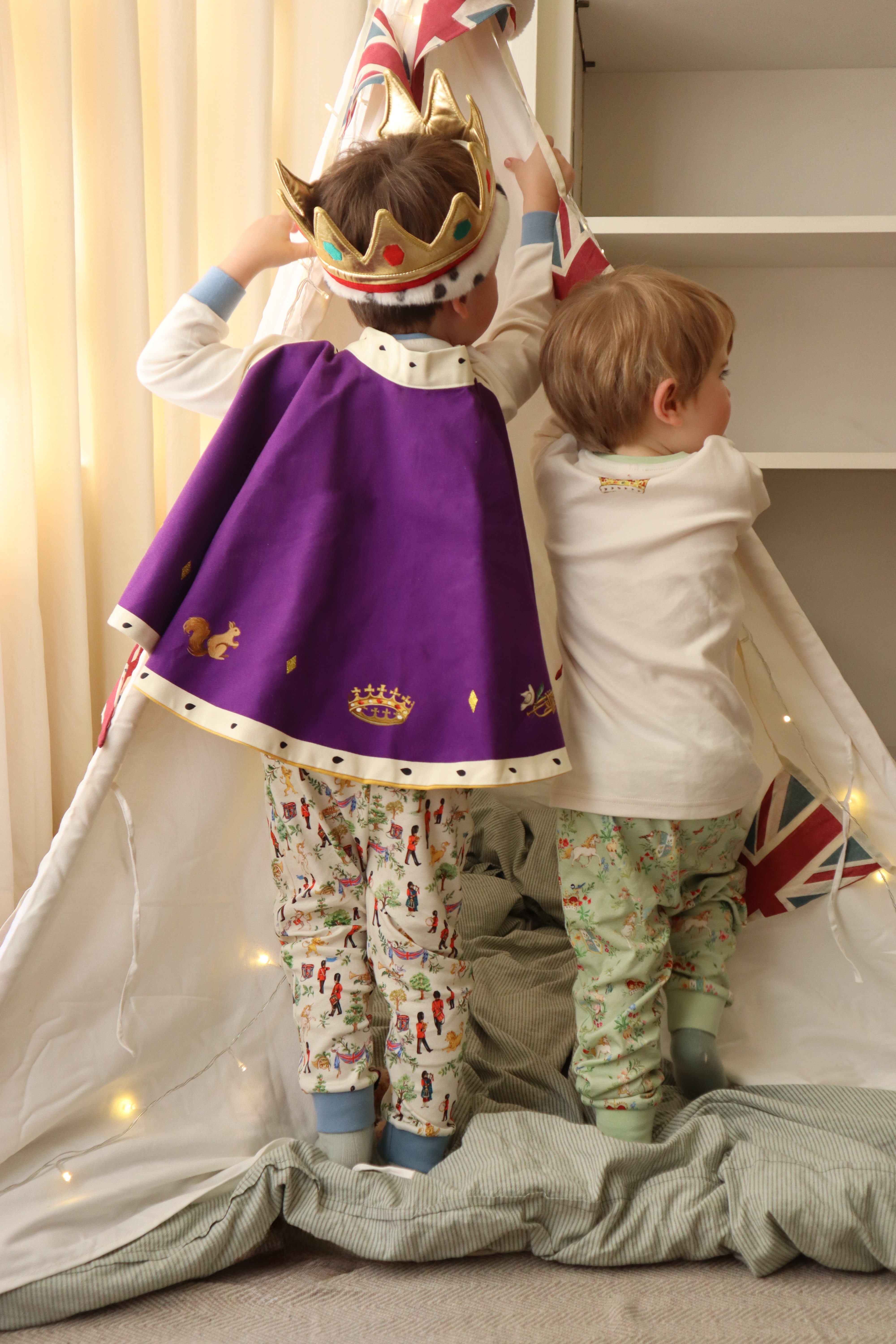 Children showing the new products in the Royal Collection Trust retail product range