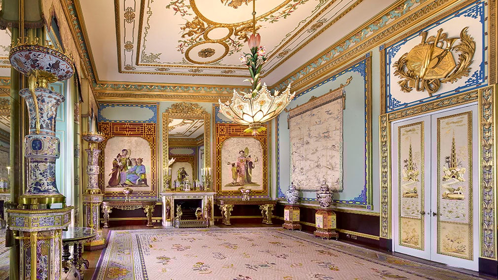 The Centre Room today. A ornately decorated room with a lotus shaped chandelier and porcelain vases.