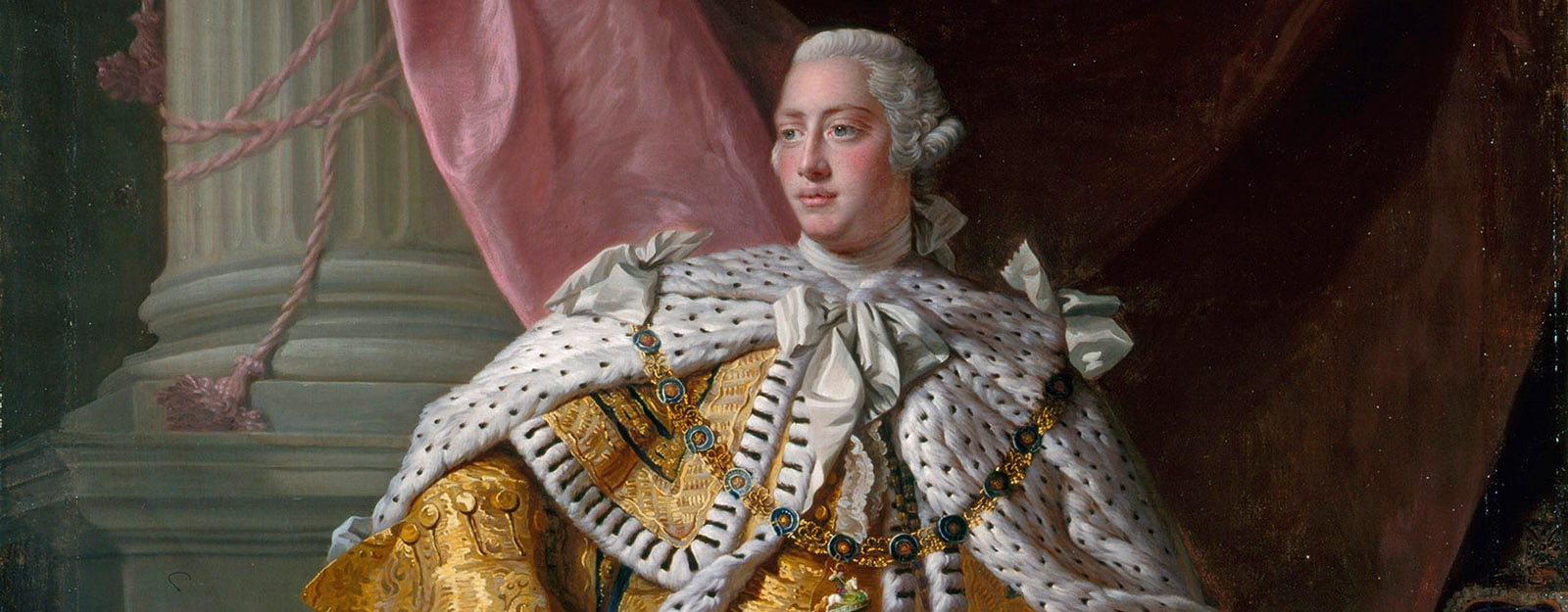 Portrait of George III in his coronation robes (RCIN 405307) George III stands wearing his yellow coronation robes.