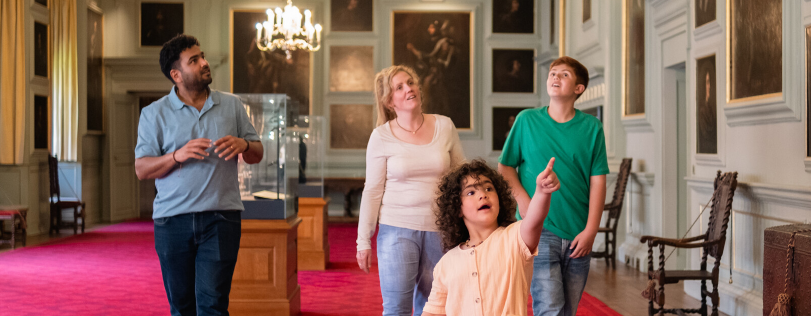 Family exploring the Great Gallery, Palace of Holyroodhouse